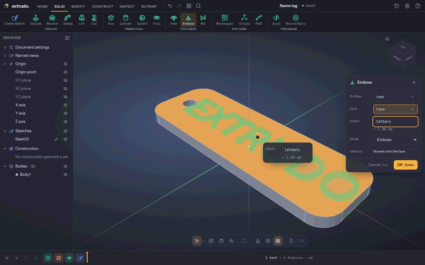 The Emboss dialog with the text and the top face